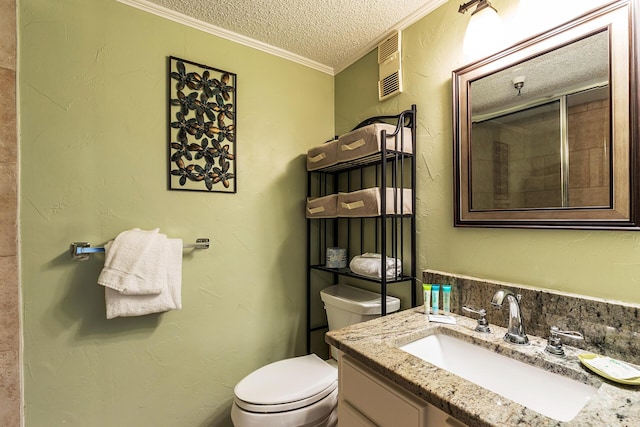 790 Santa Rosa Blvd Unit 304, Fort Walton Beach, FL 32548 - bathroom with toilet, vanity, a textured ceiling, ornamental molding, and a textured wall
