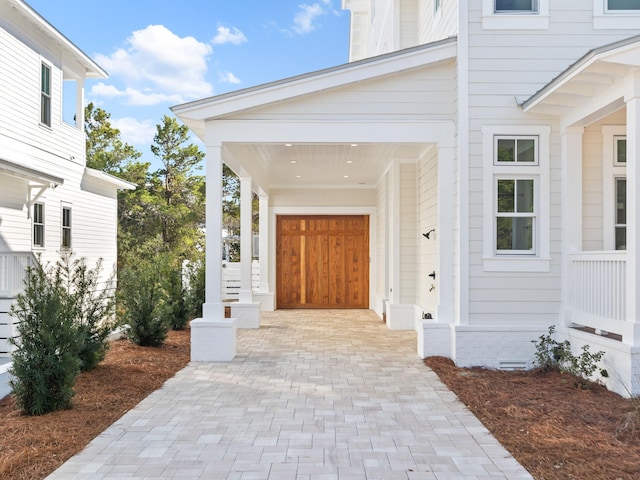 375 Morgans Trl, Santa Rosa Beach, FL 32459 - view of exterior entry with crawl space and decorative driveway