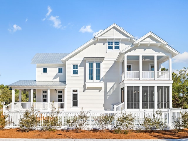 375 Morgans Trl, Santa Rosa Beach, FL 32459 - back of house featuring a balcony, a sunroom, fence, metal roof, and ceiling fan