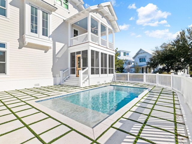 375 Morgans Trl, Santa Rosa Beach, FL 32459 - view of pool featuring a sunroom, a fenced in pool, fence, and a patio area