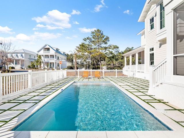 375 Morgans Trl, Santa Rosa Beach, FL 32459 - view of swimming pool featuring a patio, a fenced in pool, fence, and a residential view