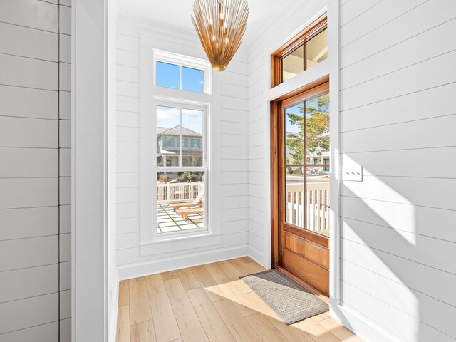 375 Morgans Trl, Santa Rosa Beach, FL 32459 - doorway to outside featuring hardwood / wood-style floors, a chandelier, and wooden walls