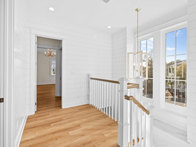 375 Morgans Trl, Santa Rosa Beach, FL 32459 - hallway with an upstairs landing, recessed lighting, light wood-type flooring, ornamental molding, and a notable chandelier