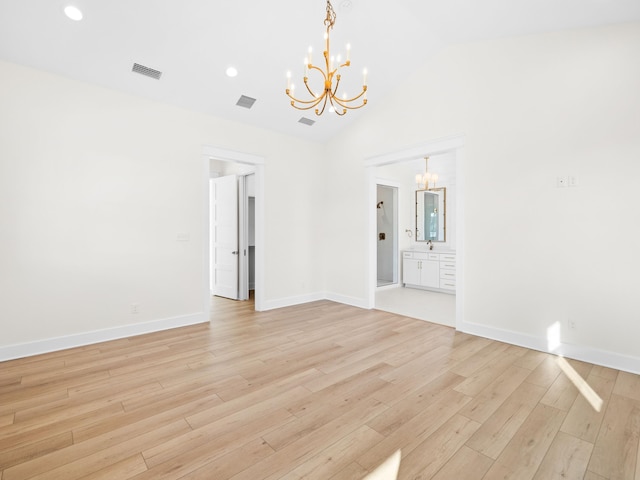 375 Morgans Trl, Santa Rosa Beach, FL 32459 - unfurnished room featuring vaulted ceiling, a chandelier, light wood finished floors, baseboards, and visible vents