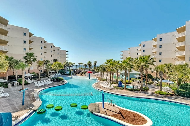 community pool featuring a patio area