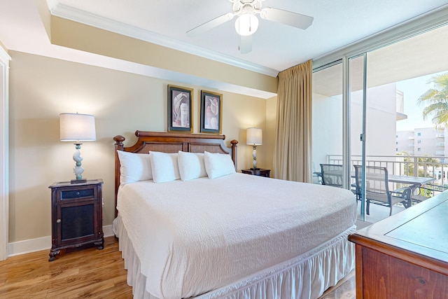 bedroom with access to exterior, light wood finished floors, crown molding, and baseboards