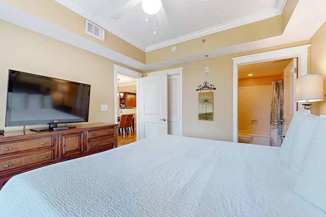 bedroom with visible vents, connected bathroom, a closet, crown molding, and ceiling fan