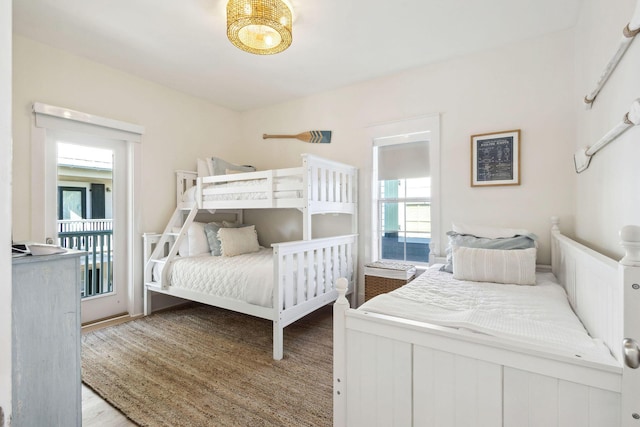 198 Somerset Bridge Rd Unit 120, Santa Rosa Beach, FL 32459 - bedroom featuring wood finished floors and access to exterior