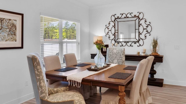 33 Spoonbill Rd, Santa Rosa Beach, FL 32459 - dining area featuring crown molding, baseboards, and wood finished floors
