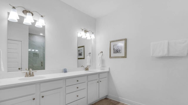 33 Spoonbill Rd, Santa Rosa Beach, FL 32459 - full bath featuring a shower stall, double vanity, baseboards, and a sink