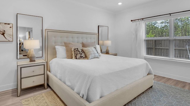 33 Spoonbill Rd, Santa Rosa Beach, FL 32459 - bedroom featuring recessed lighting, ornamental molding, baseboards, and wood finished floors