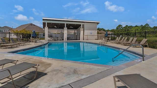 33 Spoonbill Rd, Santa Rosa Beach, FL 32459 - community pool with a patio area, ceiling fan, and fence
