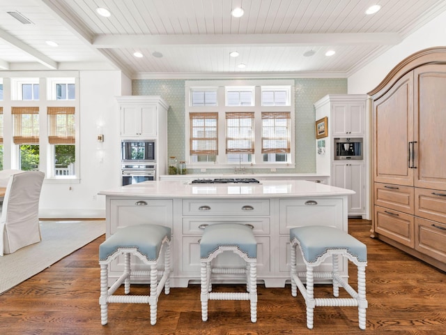 223 Western Lake Dr, Santa Rosa Beach, FL 32459 - kitchen with light countertops, a breakfast bar area, gas stovetop, built in microwave, and oven
