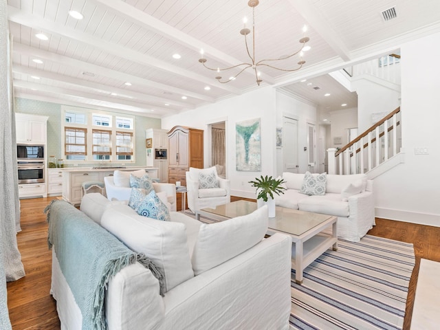 223 Western Lake Dr, Santa Rosa Beach, FL 32459 - living room featuring visible vents, a chandelier, beamed ceiling, baseboards, and wood finished floors