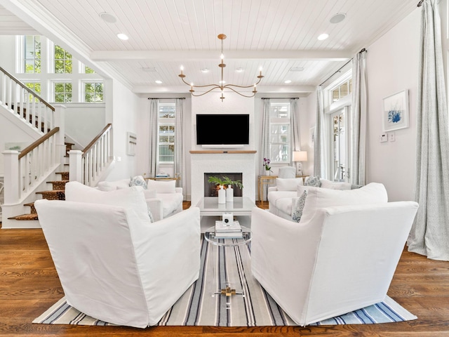 223 Western Lake Dr, Santa Rosa Beach, FL 32459 - living area with stairs, beamed ceiling, wood finished floors, and a wealth of natural light