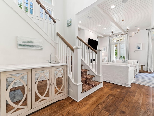 223 Western Lake Dr, Santa Rosa Beach, FL 32459 - stairs featuring wood finished floors, recessed lighting, beam ceiling, an inviting chandelier, and wooden ceiling