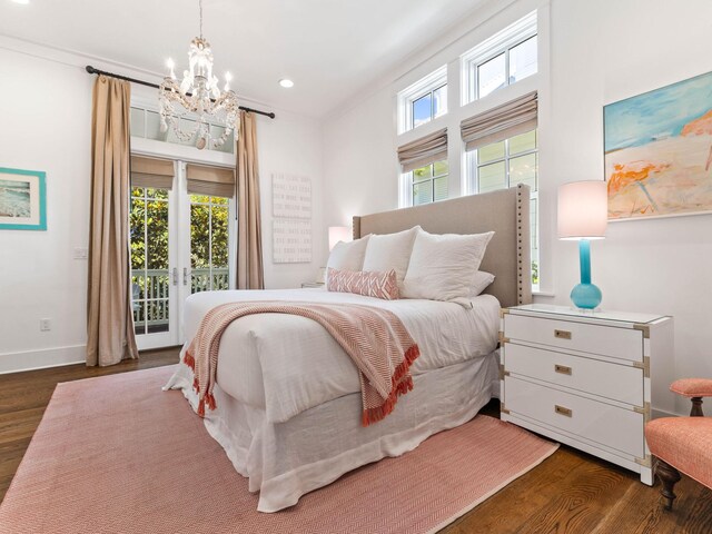 223 Western Lake Dr, Santa Rosa Beach, FL 32459 - bedroom with recessed lighting, baseboards, access to exterior, a notable chandelier, and wood finished floors