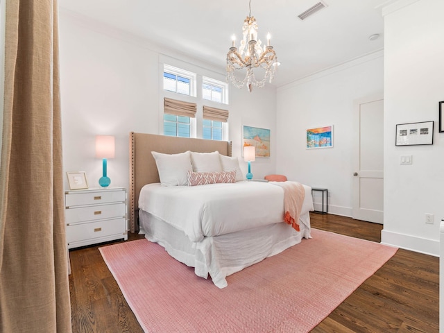 223 Western Lake Dr, Santa Rosa Beach, FL 32459 - bedroom featuring crown molding, an inviting chandelier, baseboards, visible vents, and dark wood-style flooring