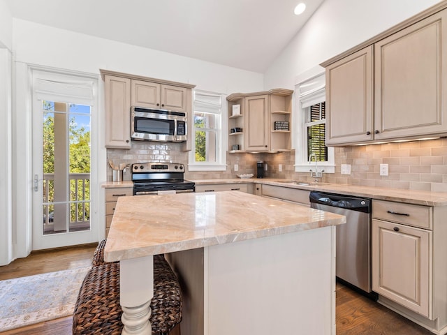 223 Western Lake Dr, Santa Rosa Beach, FL 32459 - kitchen featuring a sink, open shelves, tasteful backsplash, appliances with stainless steel finishes, and lofted ceiling