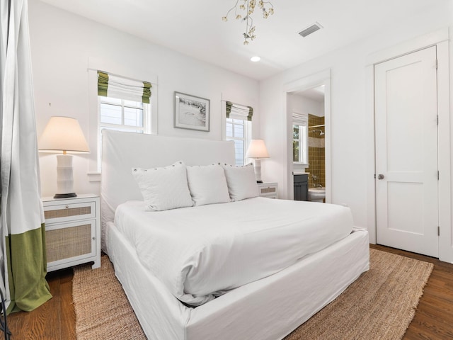 223 Western Lake Dr, Santa Rosa Beach, FL 32459 - bedroom with visible vents, recessed lighting, wood finished floors, and ensuite bathroom