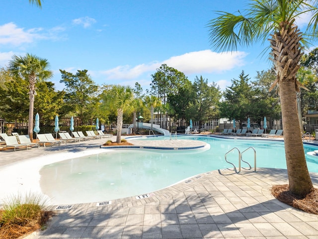223 Western Lake Dr, Santa Rosa Beach, FL 32459 - pool with a water slide, fence, and a patio
