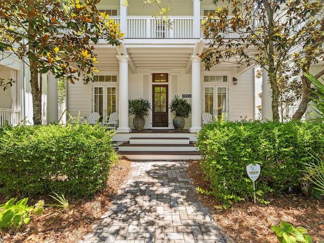 223 Western Lake Dr, Santa Rosa Beach, FL 32459 - doorway to property with a balcony, covered porch, and french doors