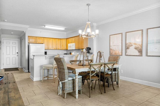 dining room featuring a chandelier, light tile patterned flooring, baseboards, and ornamental molding