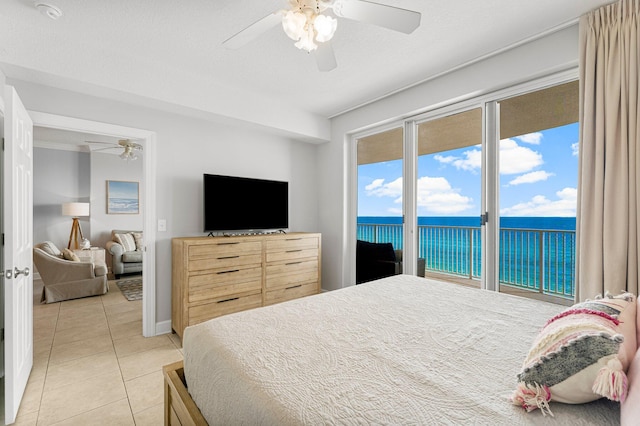 bedroom featuring light tile patterned floors, a textured ceiling, ceiling fan, and access to outside
