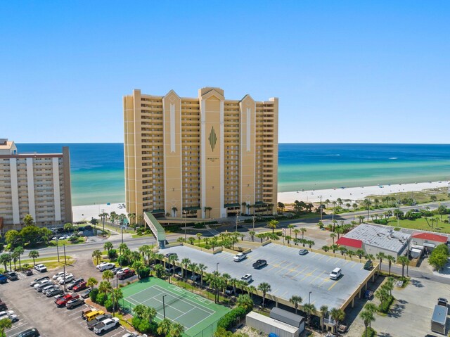 drone / aerial view featuring a view of the beach and a water view
