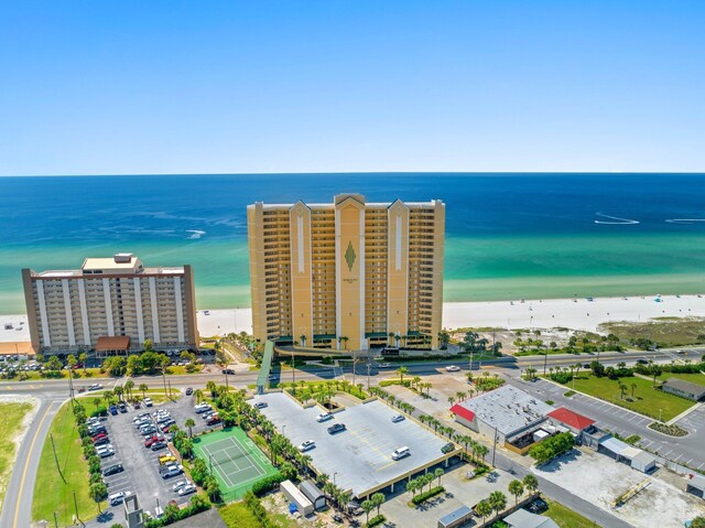 aerial view featuring a view of the beach and a water view