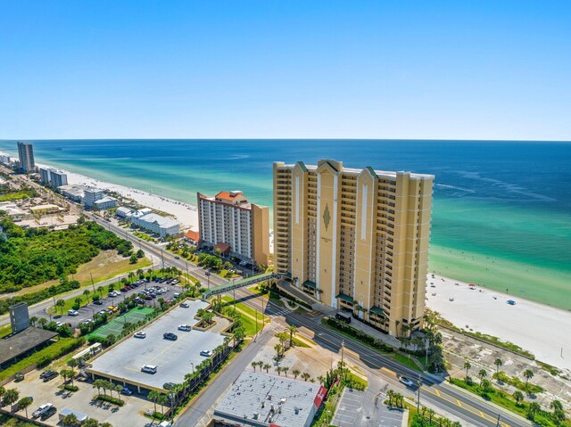 bird's eye view with a city view, a beach view, and a water view