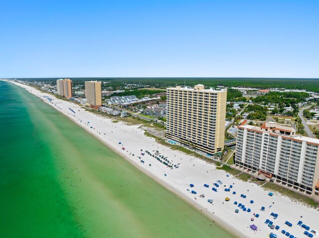 bird's eye view featuring a view of city, a beach view, and a water view