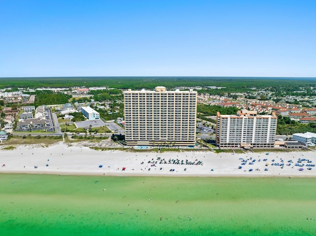 bird's eye view featuring a view of city, a beach view, and a water view