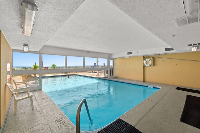 community pool with a patio area
