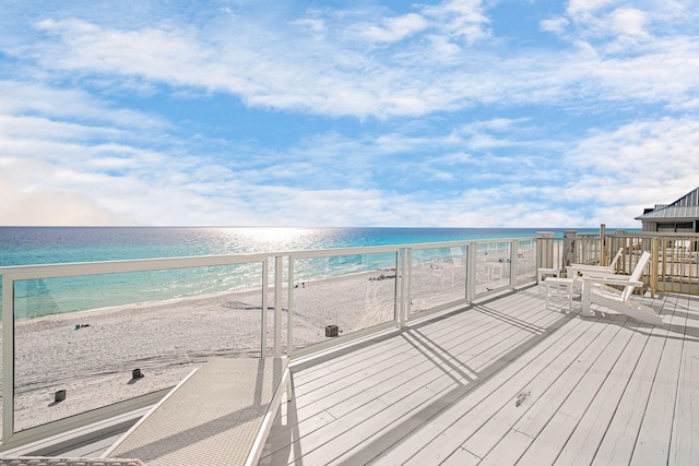 exterior space featuring a water view and a view of the beach
