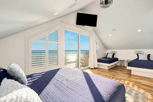 bedroom featuring wood finished floors, visible vents, lofted ceiling, recessed lighting, and access to outside