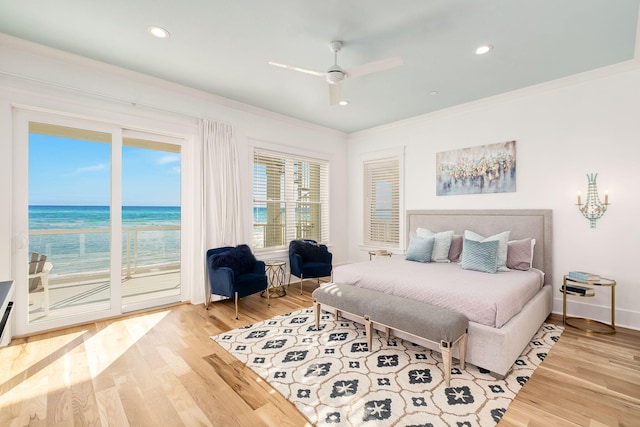 bedroom featuring recessed lighting, wood finished floors, crown molding, and access to outside