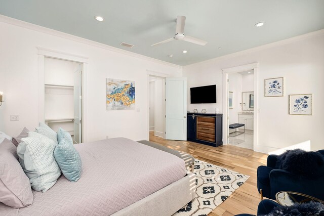 bedroom featuring recessed lighting, visible vents, light wood-style floors, and crown molding