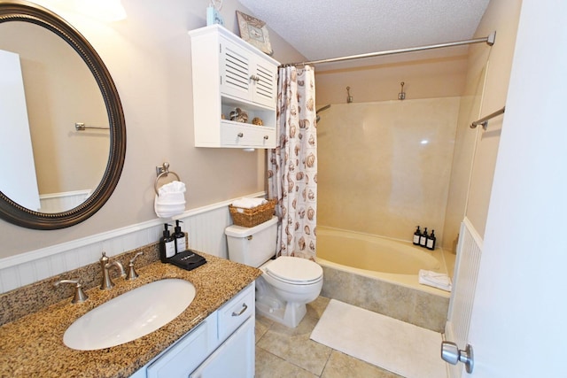 775 Gulf Shore Dr Unit 8108, Destin, FL 32541 - full bath featuring a textured ceiling, shower / tub combo, wainscoting, tile patterned floors, and toilet