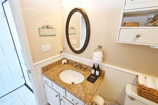 775 Gulf Shore Dr Unit 8108, Destin, FL 32541 - half bath featuring tile patterned flooring, wainscoting, and vanity