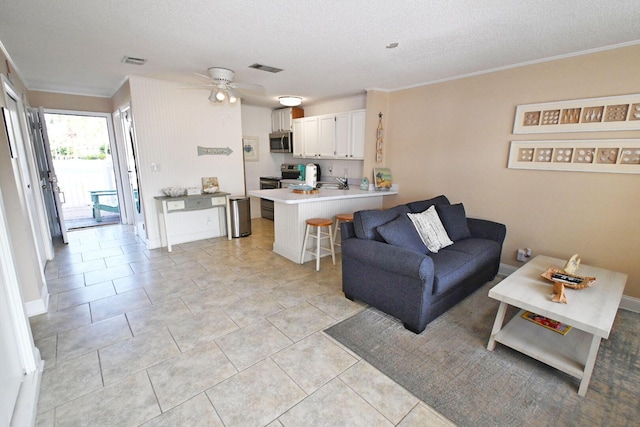 775 Gulf Shore Dr Unit 8108, Destin, FL 32541 - living room with visible vents, a textured ceiling, crown molding, and ceiling fan