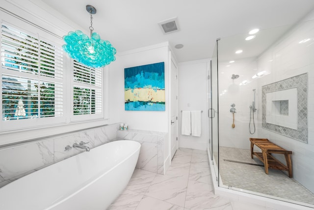 full bath with a stall shower, marble finish floor, visible vents, a freestanding bath, and tile walls
