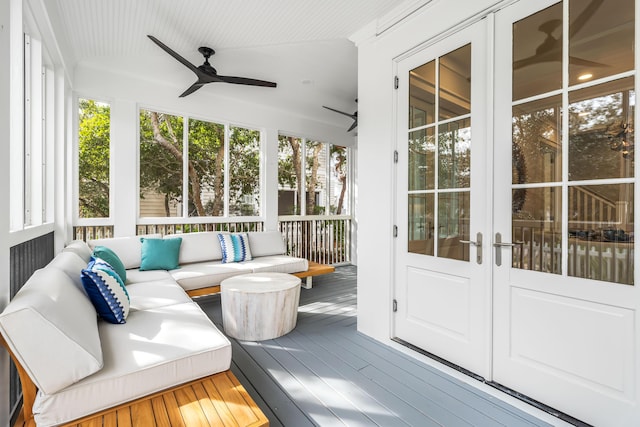 unfurnished sunroom featuring an outdoor hangout area, french doors, and a ceiling fan