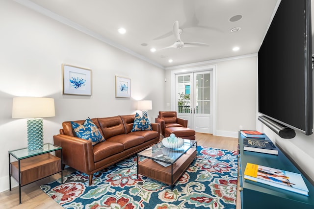 living room with a ceiling fan, light wood-type flooring, recessed lighting, and crown molding