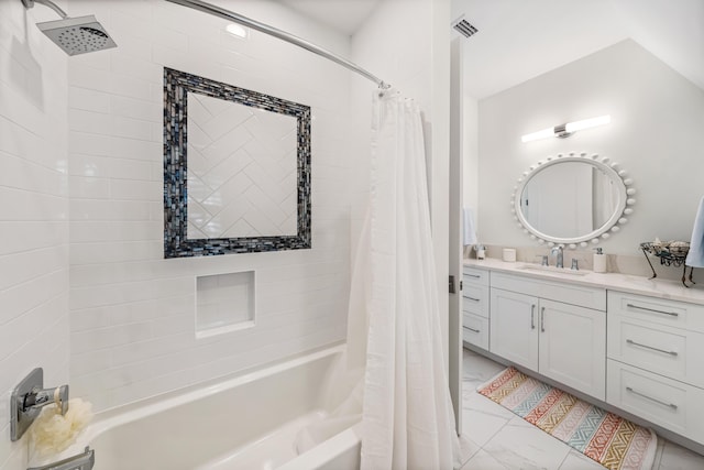 full bath featuring marble finish floor, shower / tub combo, visible vents, and vanity