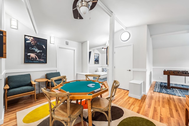 game room featuring lofted ceiling with beams, visible vents, wood finished floors, and a ceiling fan