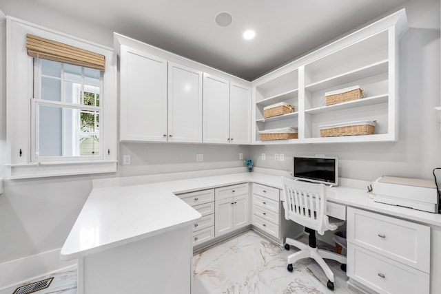 home office featuring built in desk, visible vents, recessed lighting, and marble finish floor