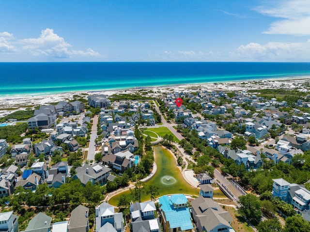 bird's eye view with a water view, a beach view, and a residential view