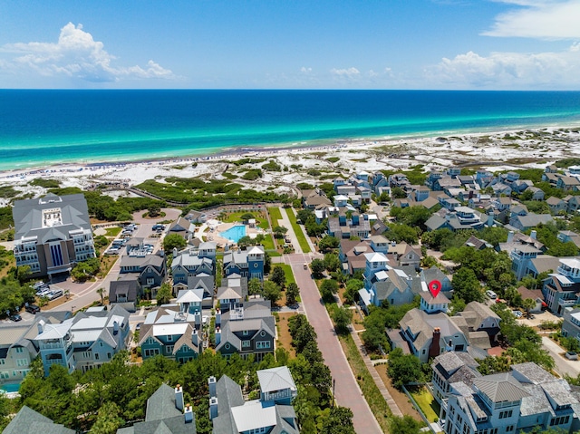 aerial view with a water view, a beach view, and a residential view