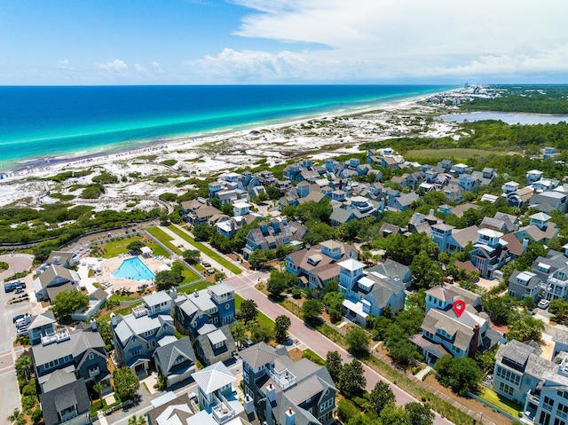 bird's eye view with a water view and a view of the beach